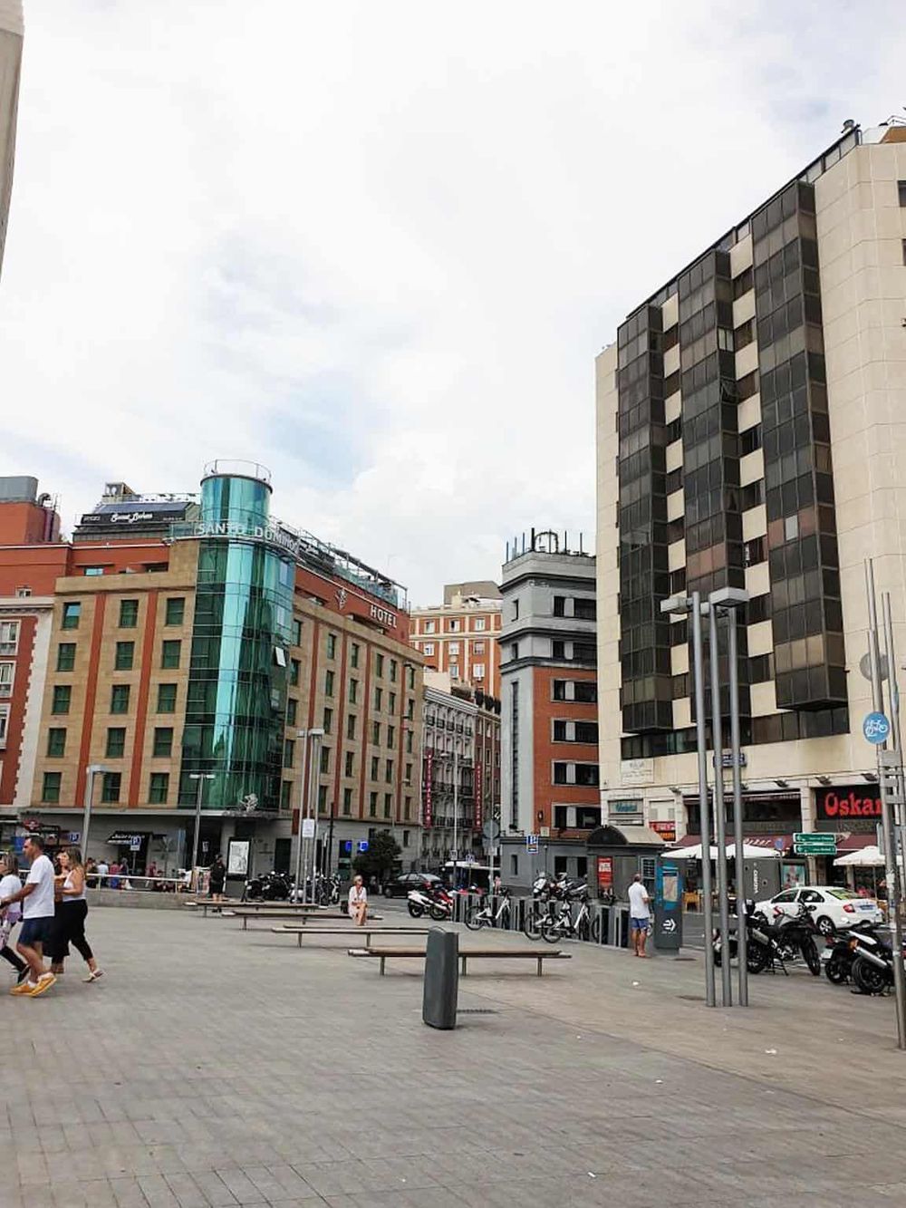 Vibrant cityscape featuring modern buildings, pedestrians, and urban infrastructure in downtown Madrid.