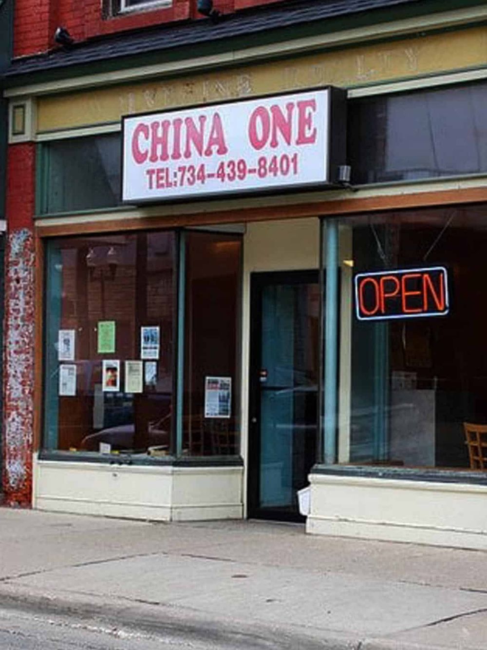 Authentic Chinese restaurant storefront with "China One" sign and neon open sign.