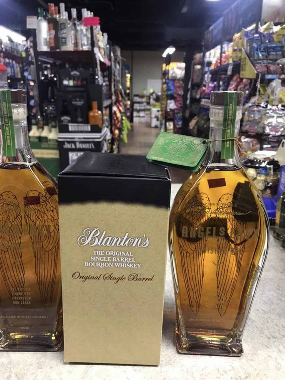 Premium bourbon whiskey bottles at a convenience store or liquor shop, essential for whiskey enthusiasts and collectors.