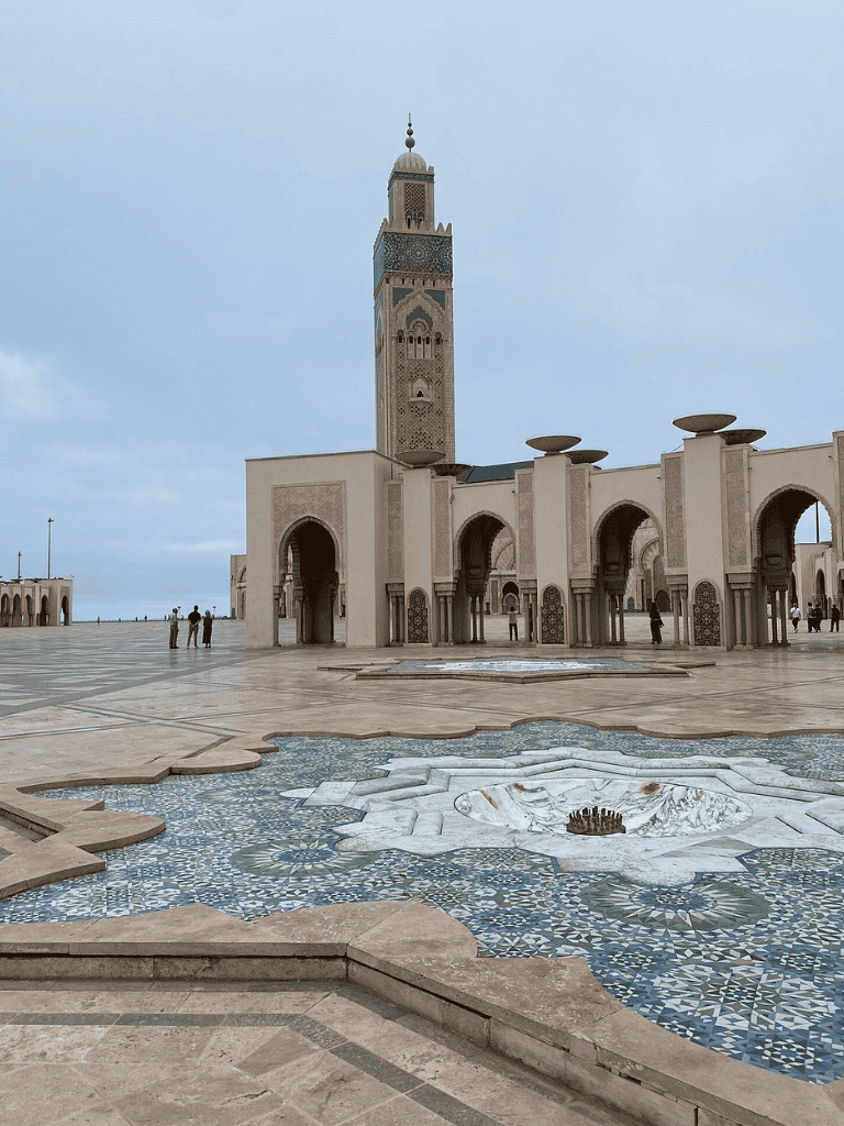 Minaret and mosque in Morocco, a historical Islamic site with intricate architectural details.