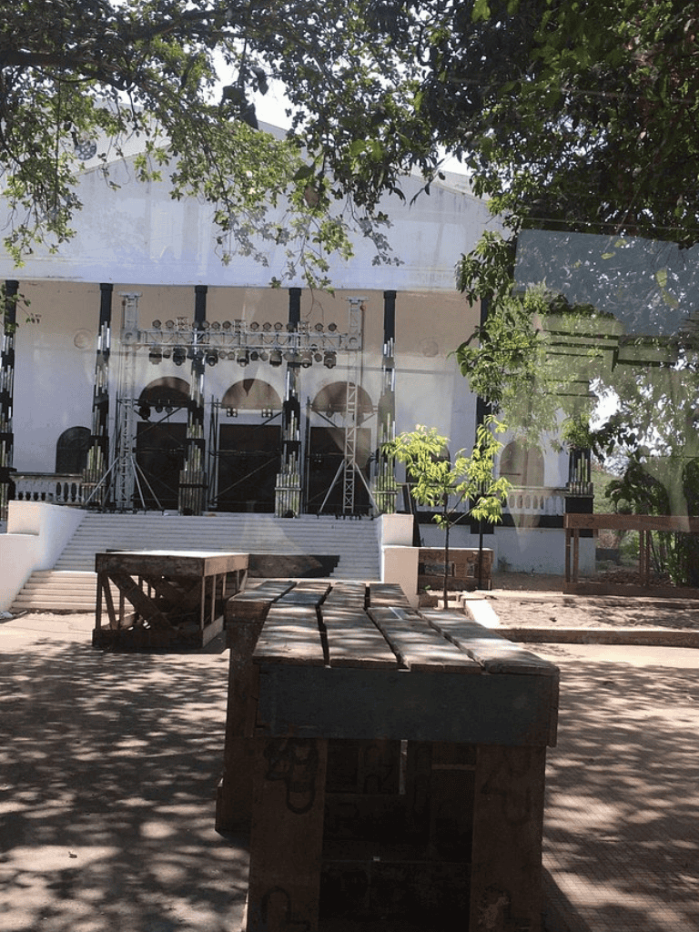 Outdoor stage setup with musical equipment at QuestForDirections event venue.