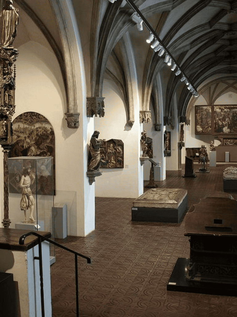 St. Peter's Basilica museum interior with sculptures and religious artwork.