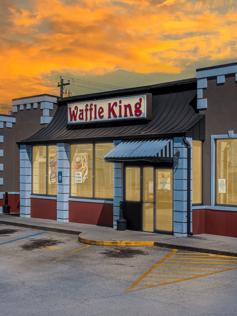 Waffle King restaurant exterior at sunset, fast food dining, breakfast, lunch, dinner.