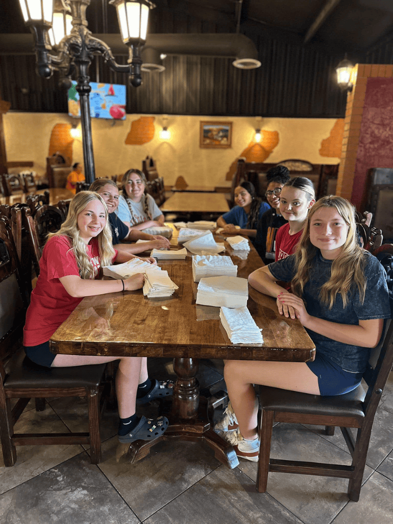 Girls group enjoying pizza night at cozy restaurant, happy and social, food, friends, dining out, camaraderie, casual dining, young women, meal, togetherness, fun atmosphere, summer evening, casual attire, friendship.