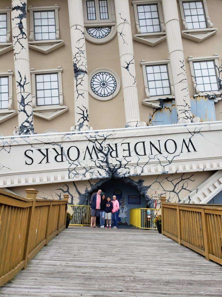 Damaged city hall building with cracked walls and people standing in front, part of QuestForDirections sightseeing tours.