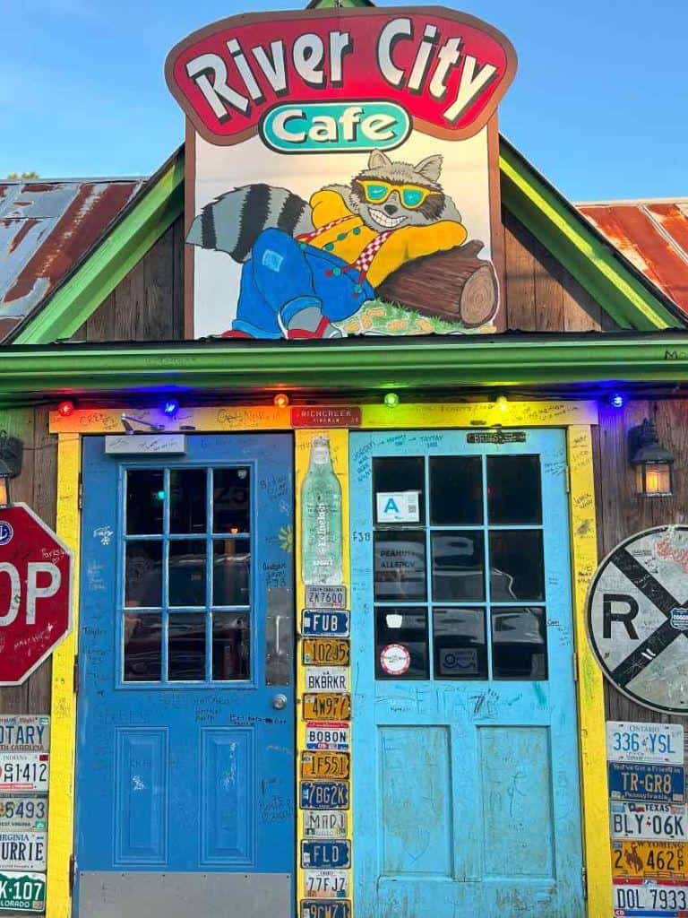 Colorful River City Cafe storefront with vibrant signage and eclectic decor, popular for casual dining and local community gathering.
