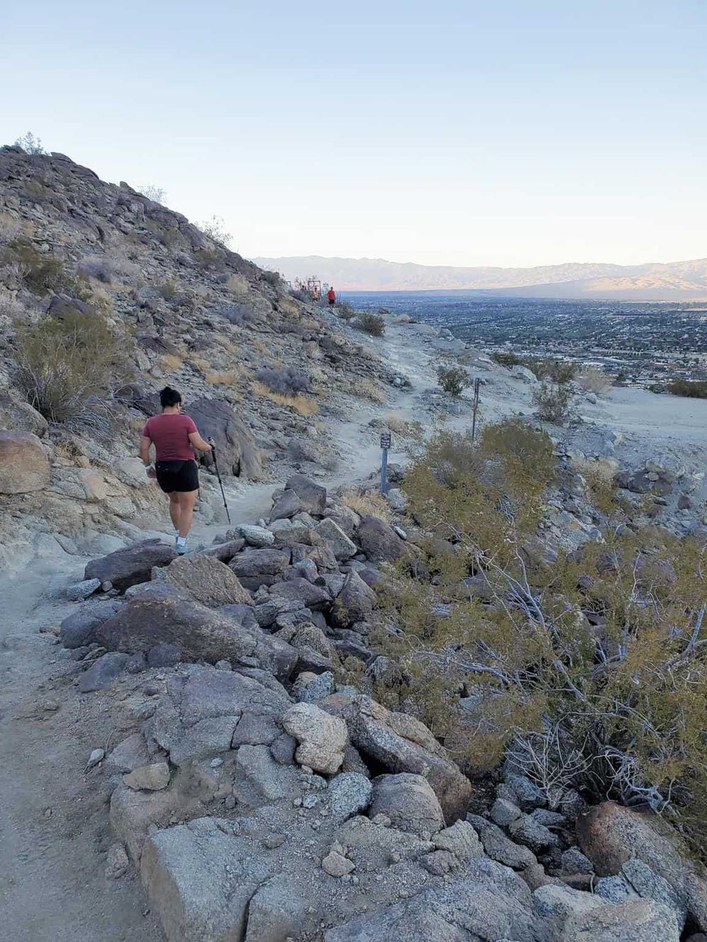 Hiking trail in desert mountains near Las Vegas, scenic mountain views, dry terrain, rocky path, outdoor adventure.