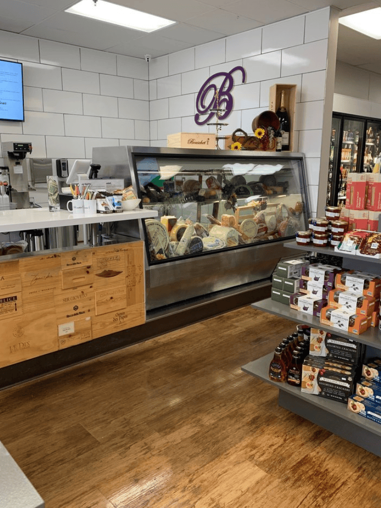 Cream cheese and cheese samplers in a refrigerated showcase at QuestForDirections store.