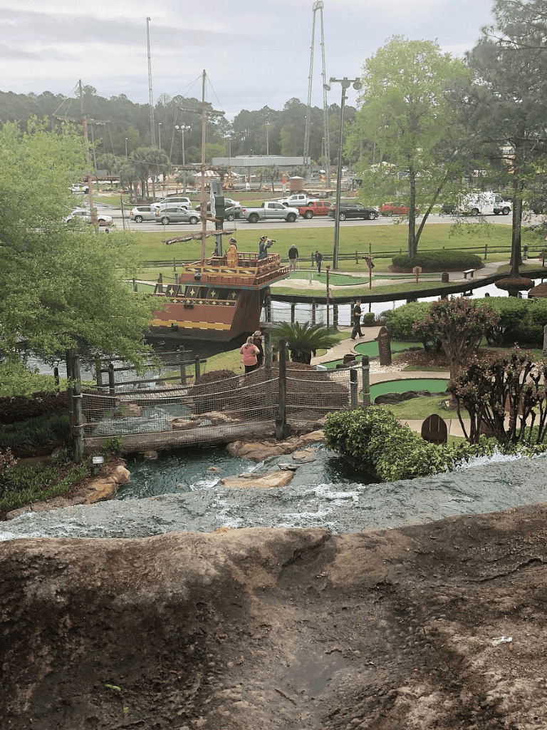 Colorful amusement park with mini water rides and attractions at Quest For Directions.