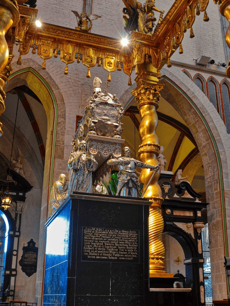 1. Ornate religious sculpture inside historic church with gold accents.