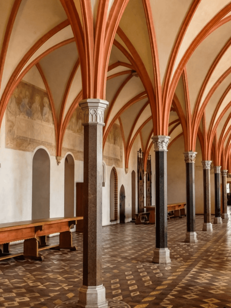 Elegant Gothic-style arches and vaulted ceilings in a historical cathedral interior.