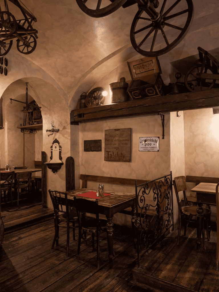 Antique rustic restaurant interior with vintage decor and wooden furniture.