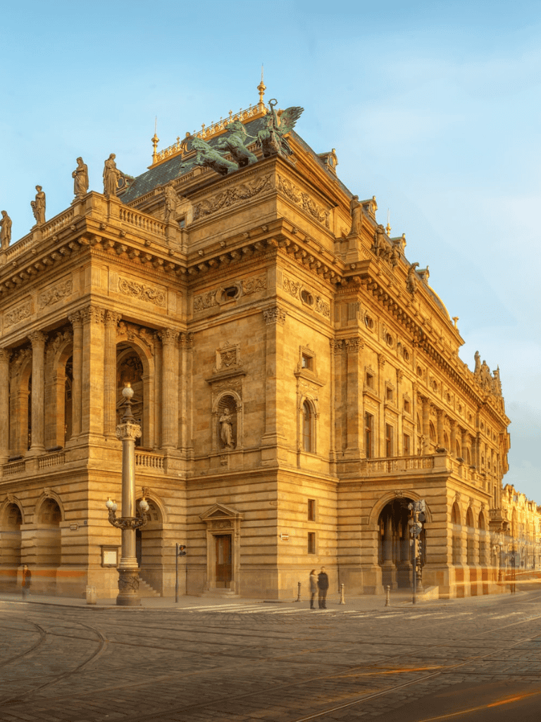 Majestic historic building with ornate architecture in warm golden tones.