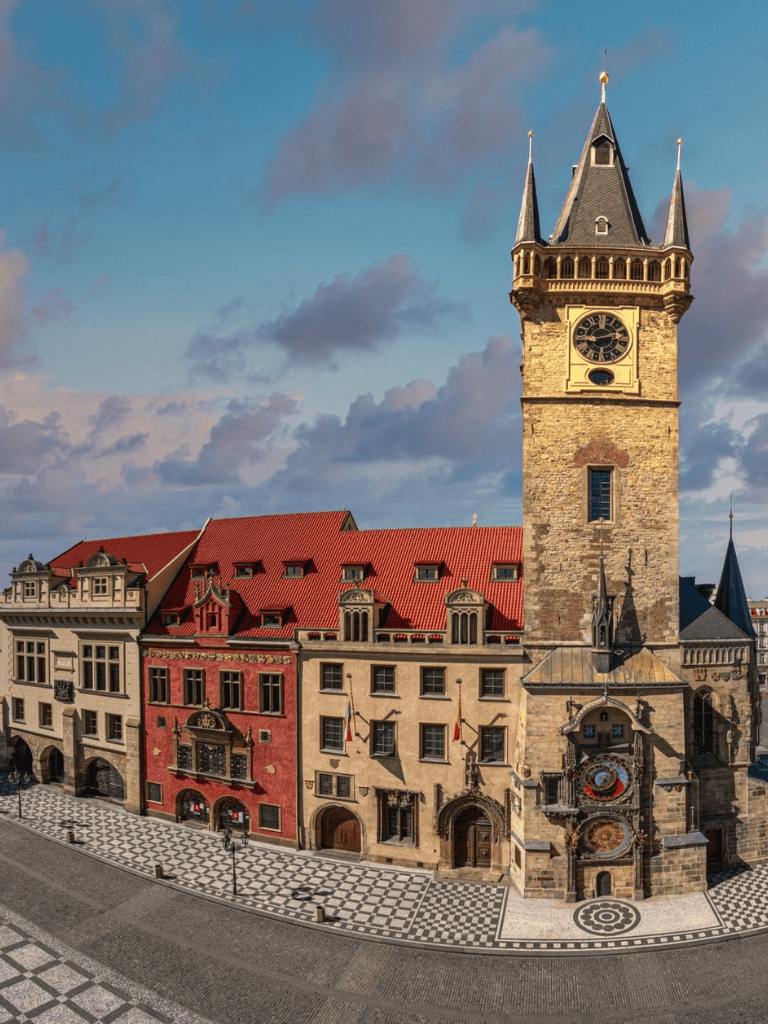 Historic clock tower in Prague, Czech Republic, showcasing Renaissance architecture and city square ambiance.