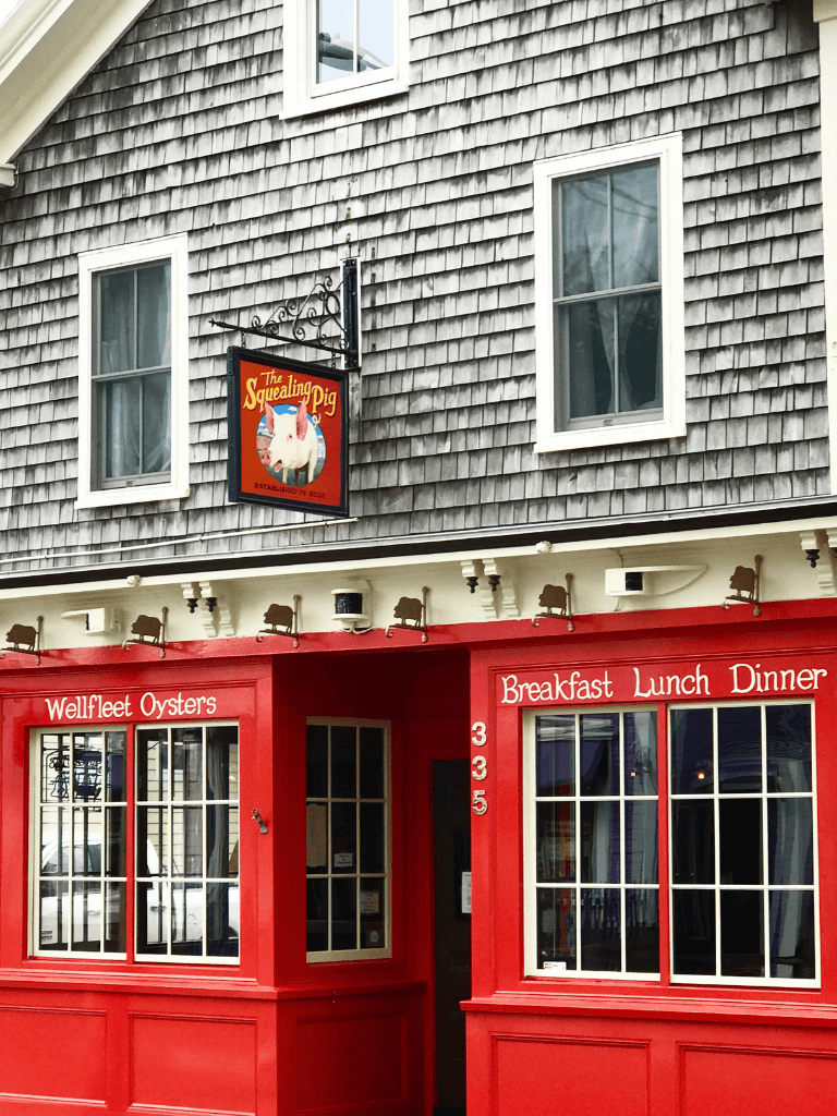 Eatery with Red Exterior and "Welfleet Oysters" Sign, Serving Breakfast, Lunch, and Dinner.
