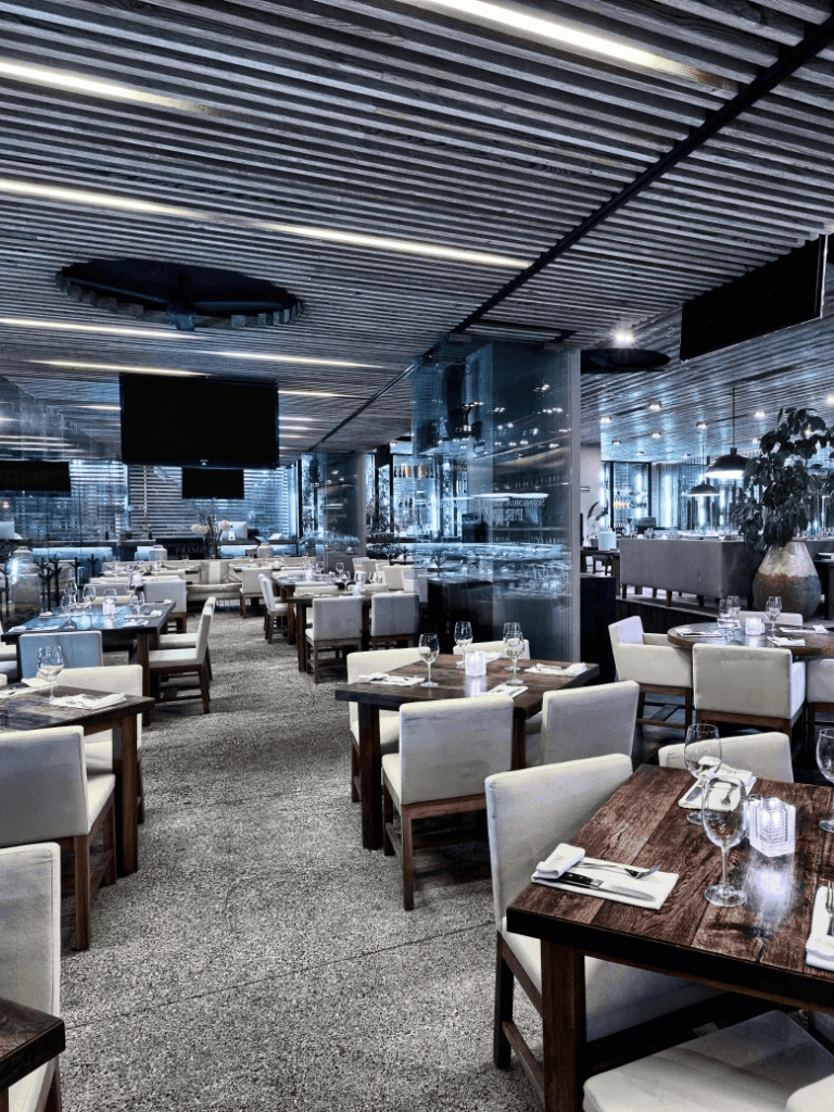 Modern restaurant interior with sleek design and elegant dining setup for fine dining experience.