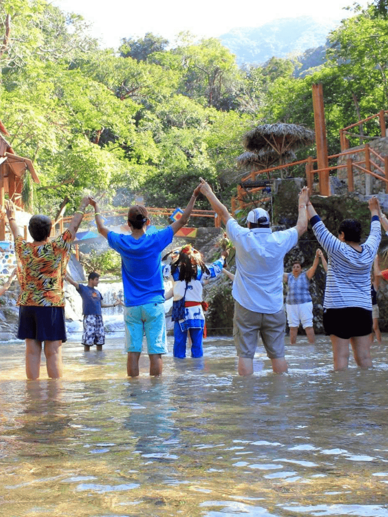 Kids playing in a swimming pool surrounded by lush greenery and nature scenes.