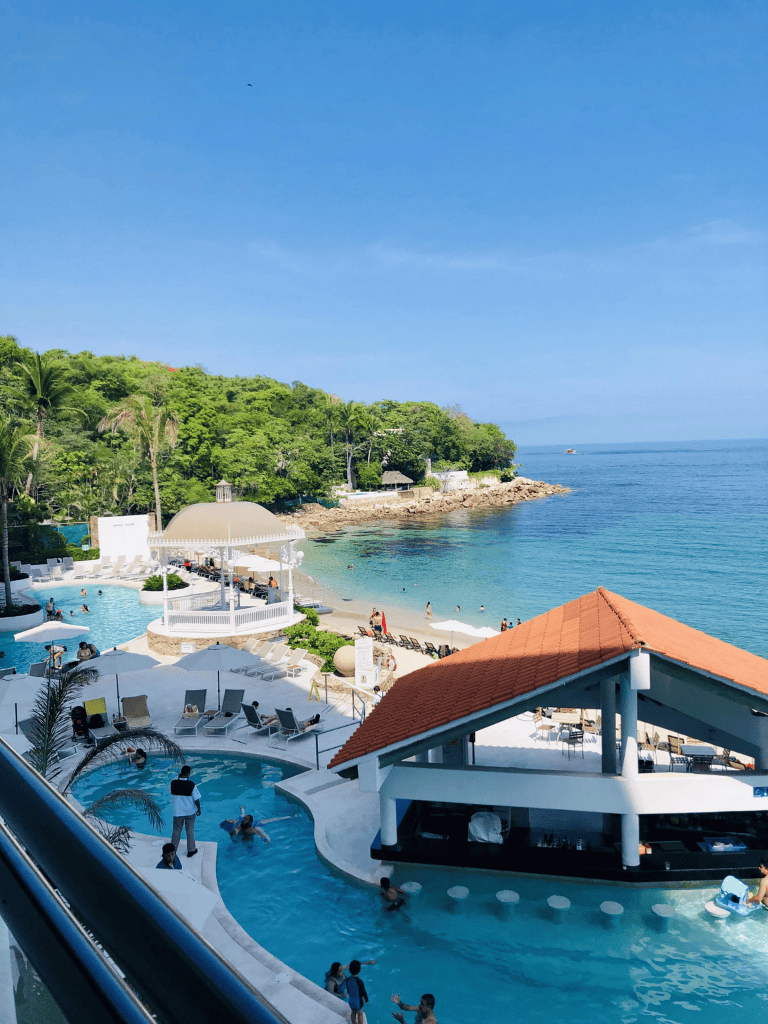 Luxury oceanfront resort with swimming pools and scenic beach views.