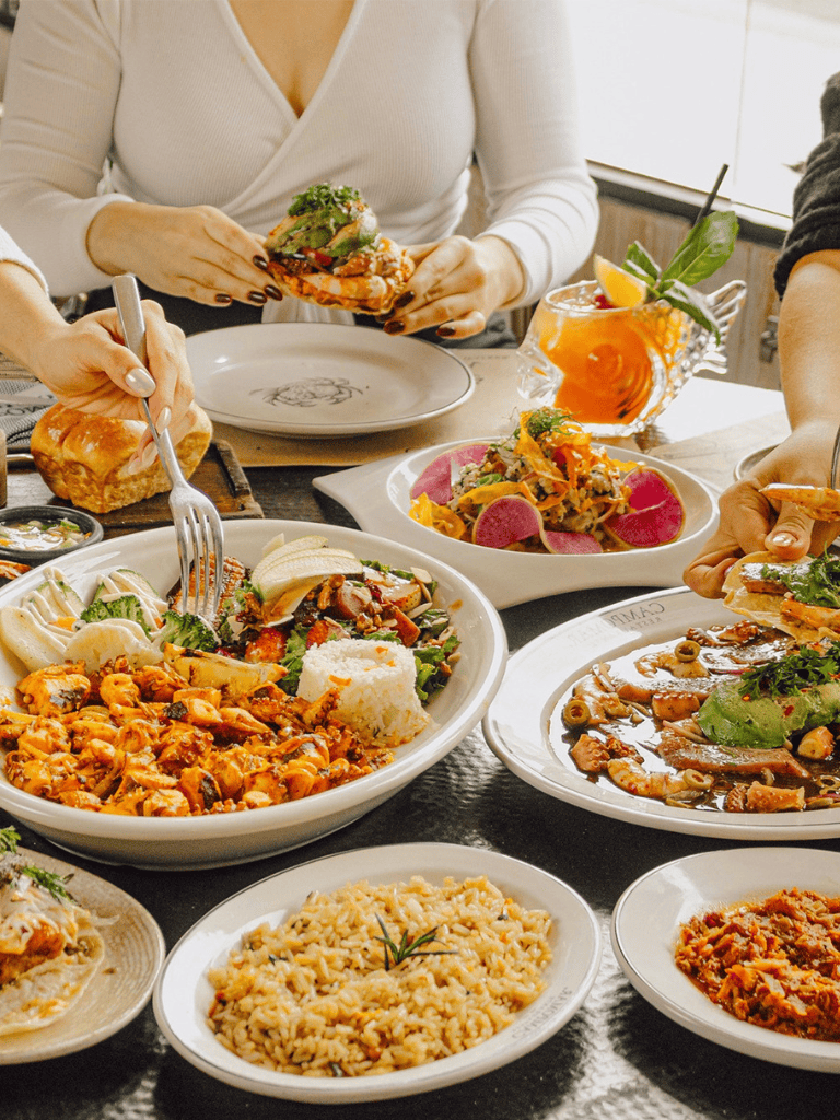 Delicious assorted international dishes served on a dining table, vibrant and appetizing meal selection.