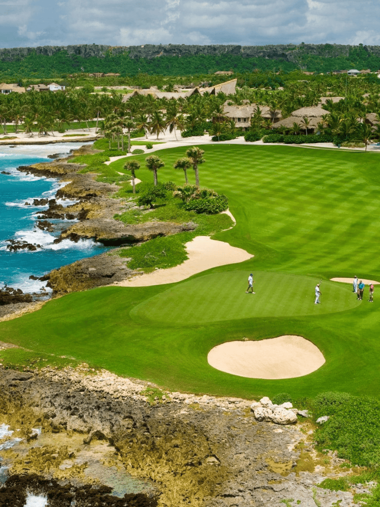 Seaside golf course with lush green fairways and ocean views, ideal for golf enthusiasts.