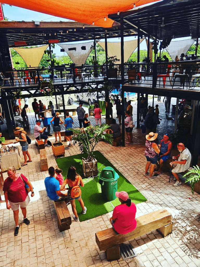 Altar text: Vibrant outdoor dining and social space at QuestForDirections restaurant.