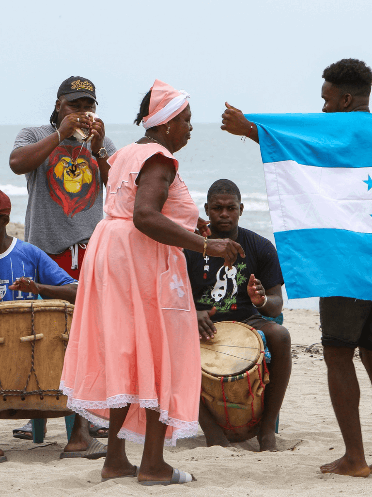 Celebrating Honduran culture with traditional music and dance at the beach festival in Honduras.