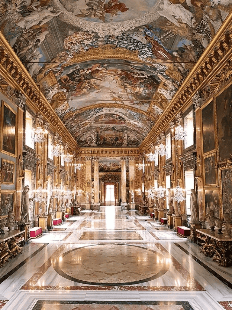 Luxurious palace hall with ornate gold accents and intricate ceiling frescoes.