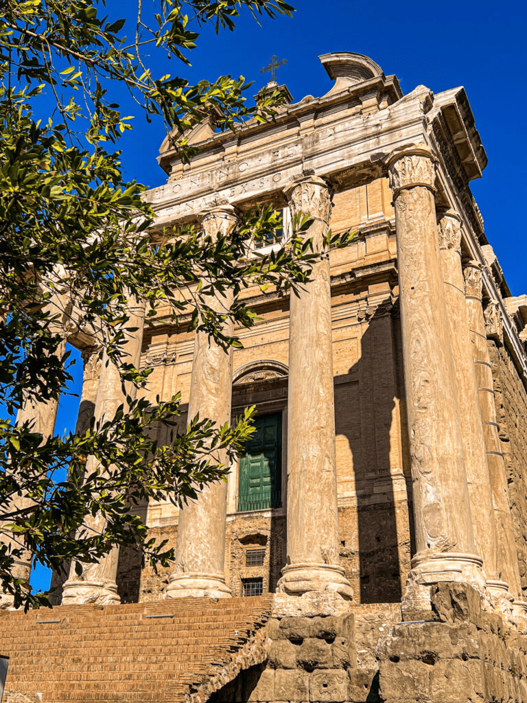 Ancient Roman architecture of the Roman Forum in Rome, Italy, with grand columns and historical ruins.