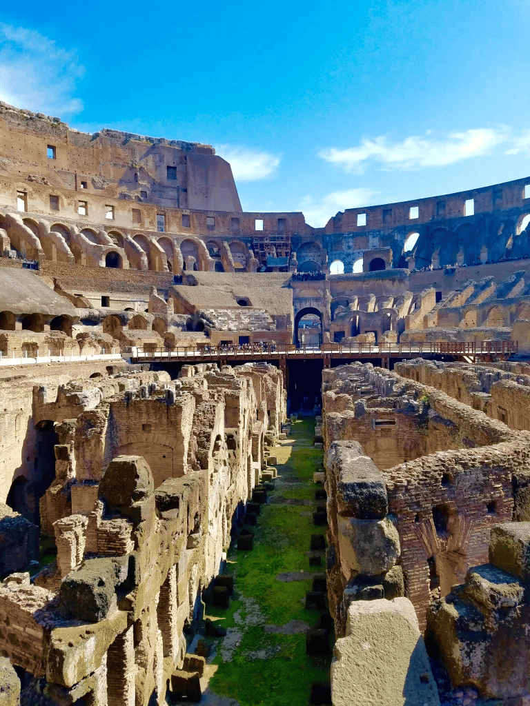 Ancient Roman Colosseum ruins with historic arches and stone architecture, great travel destination for history lovers.