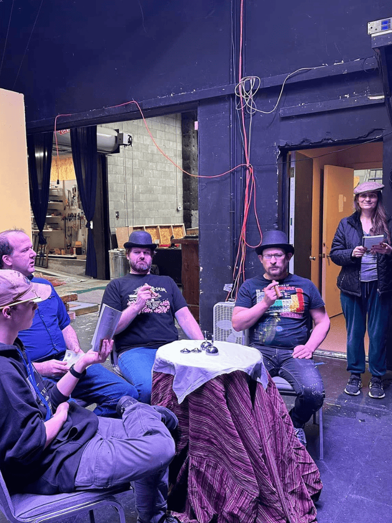 People participating in an outdoor escape room game at quest for directions event.