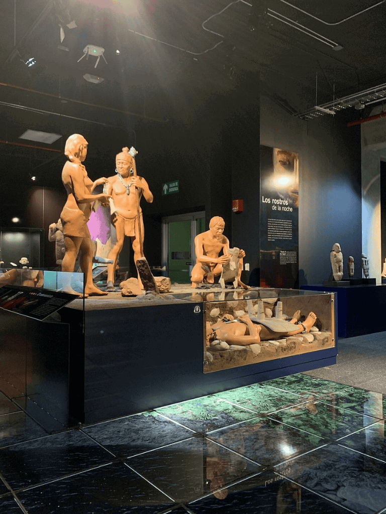 Ancient Native American sculptures display at QuestForDirections museum exhibit.