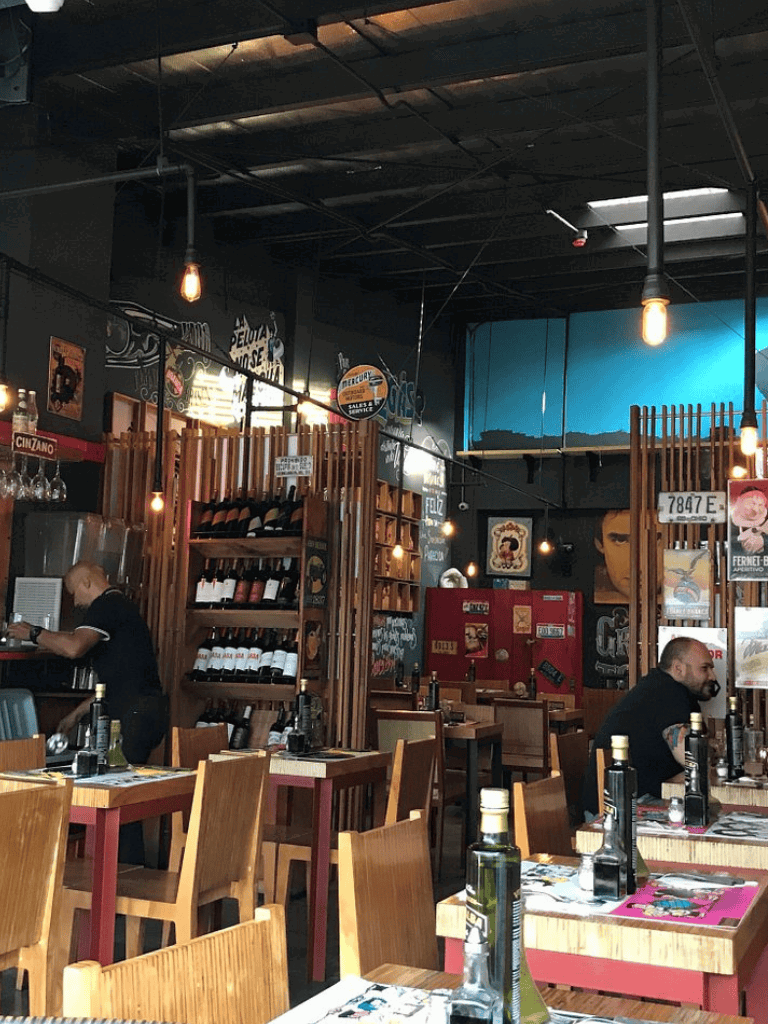 Modern restaurant interior with wooden accents and ambient lighting for dining out.