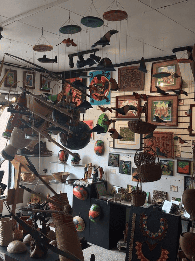 Colorful indigenous art and decor at QuestForDirections exhibit, showcasing African and Pacific Islander craftsmanship.