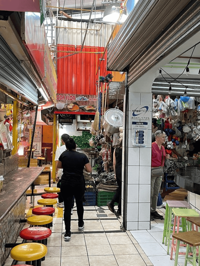 Delicious street food market in Mexico City with variety of local delicacies and vibrant atmosphere.