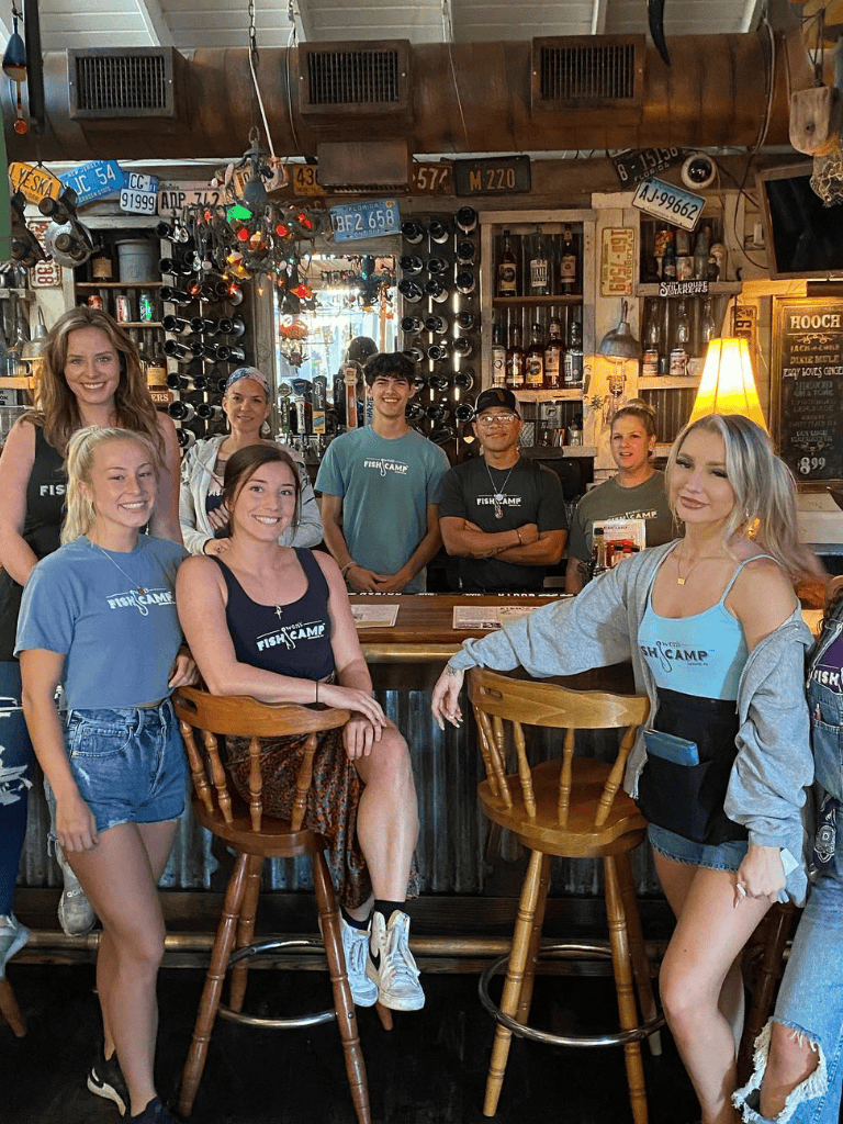 1. Diverse group of friends enjoying drinks at a cozy bar, socializing and having fun.