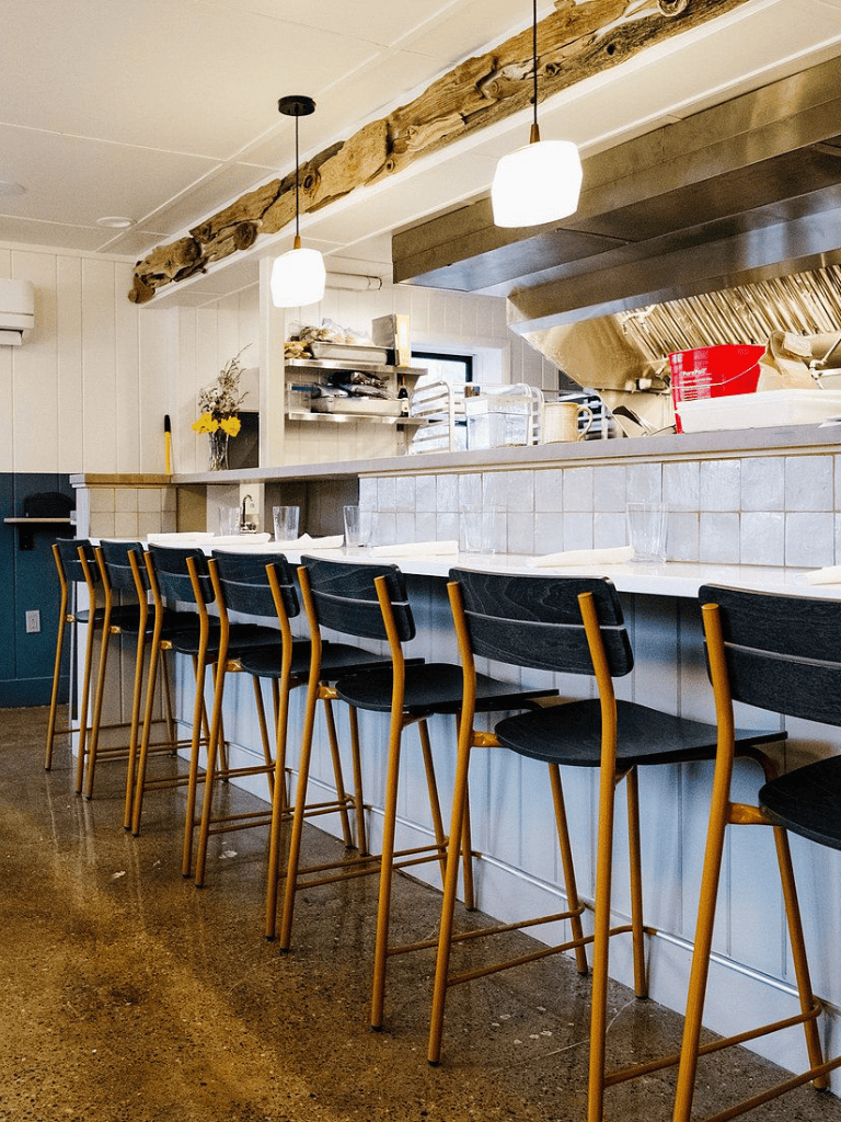 Cozy restaurant interior at QuestForDirections with bar seating and modern decor.