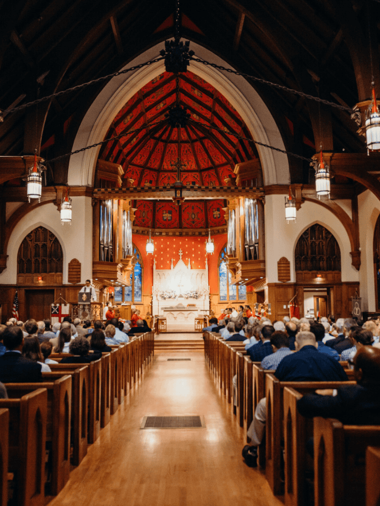 Inviting church interior with vibrant red accents and wooden pews, ideal for religious services and community gatherings.