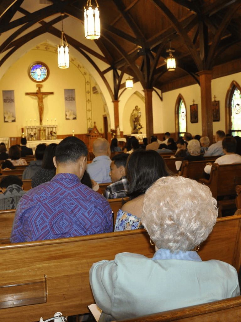 People attending church service inside a chapel for religious worship and community gathering.