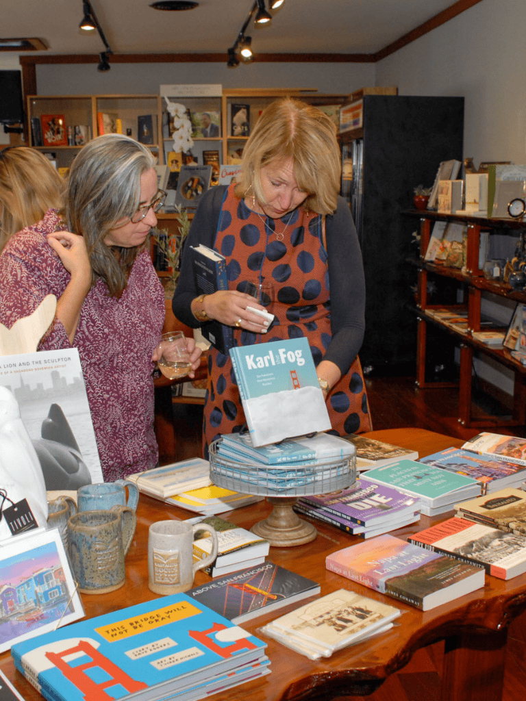 Used books on display in a bookstore event, showcasing diverse titles for readers and collectors.