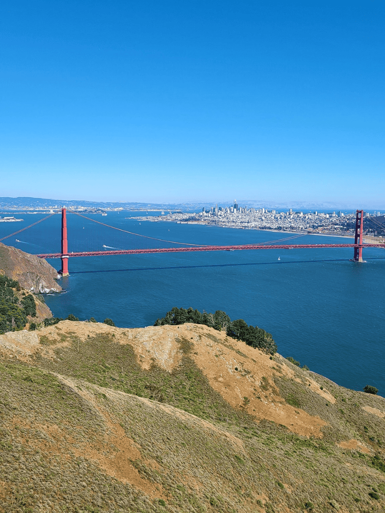 Vivid view of Golden Gate Bridge and San Francisco skyline from Marin Headlands.