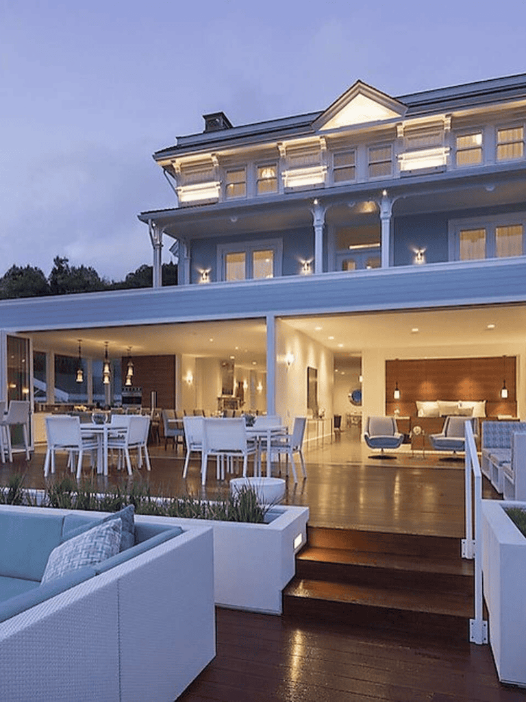 Luxurious coastal hotel with ocean-view terrace and elegant dining area.