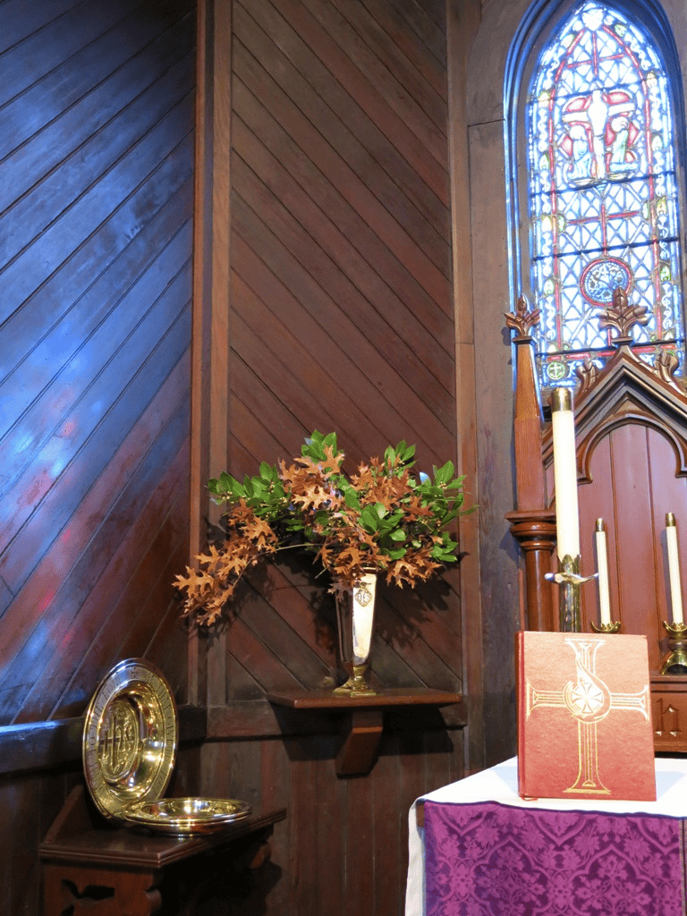 Stained glass window and religious decor inside church, sacred worship space, spiritual interior design.