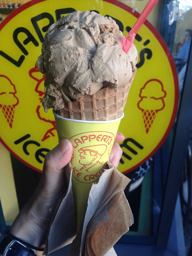 Creamy ice cream cone at Lappert's Ice Cream shop, perfect for summer desserts.
