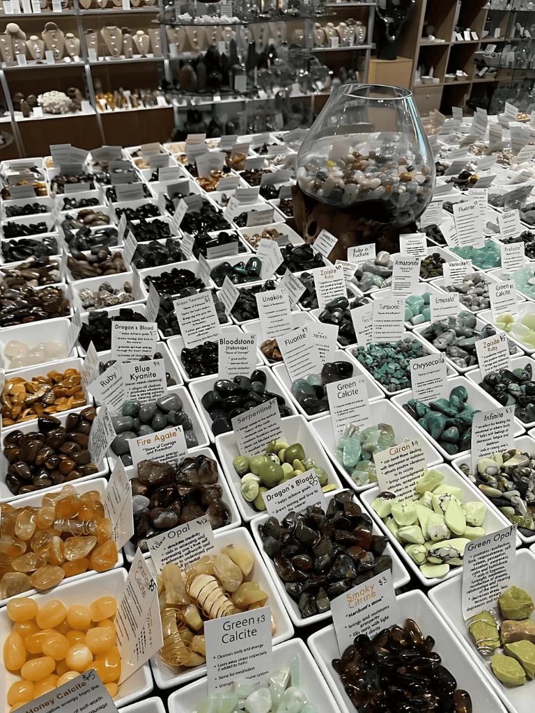 Relished gemstone jewelry and mineral specimens at QuestForDirections store exhibit.