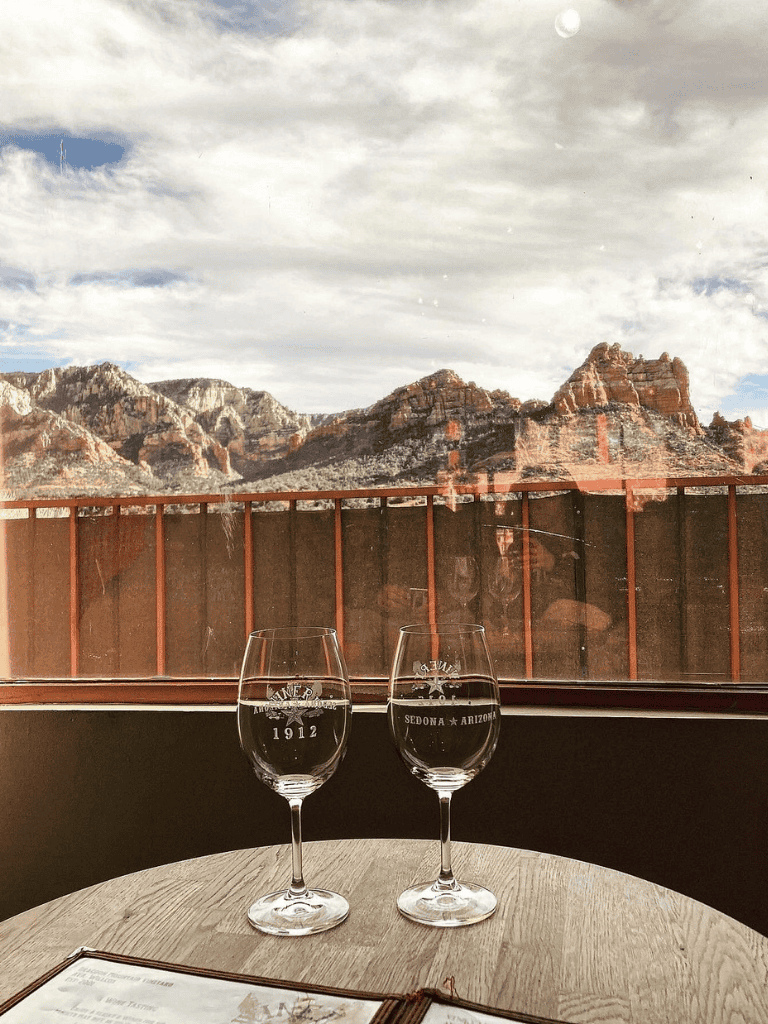 Vineyard view with red rock mountains in Sedona, Arizona, perfect for wine tasting and relaxation.