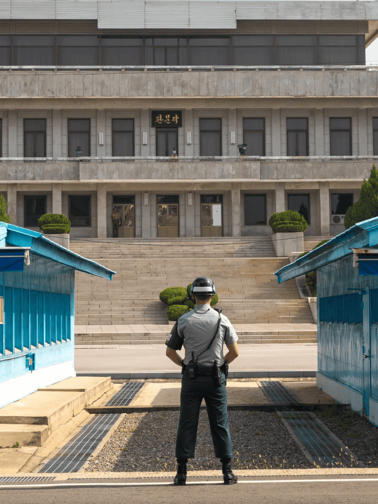 Accessible police officer standing in front of government building in Seoul, South Korea.