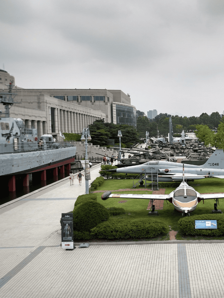 Military museum outdoor exhibits showcasing historic ships and aircraft for educational visits and military history enthusiasts.
