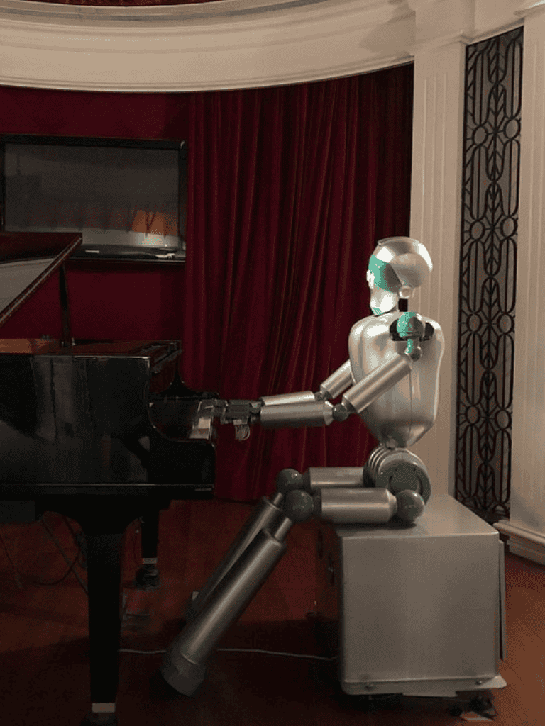 Robotic piano player at QuestForDirections event, showcasing innovative AI music technology.