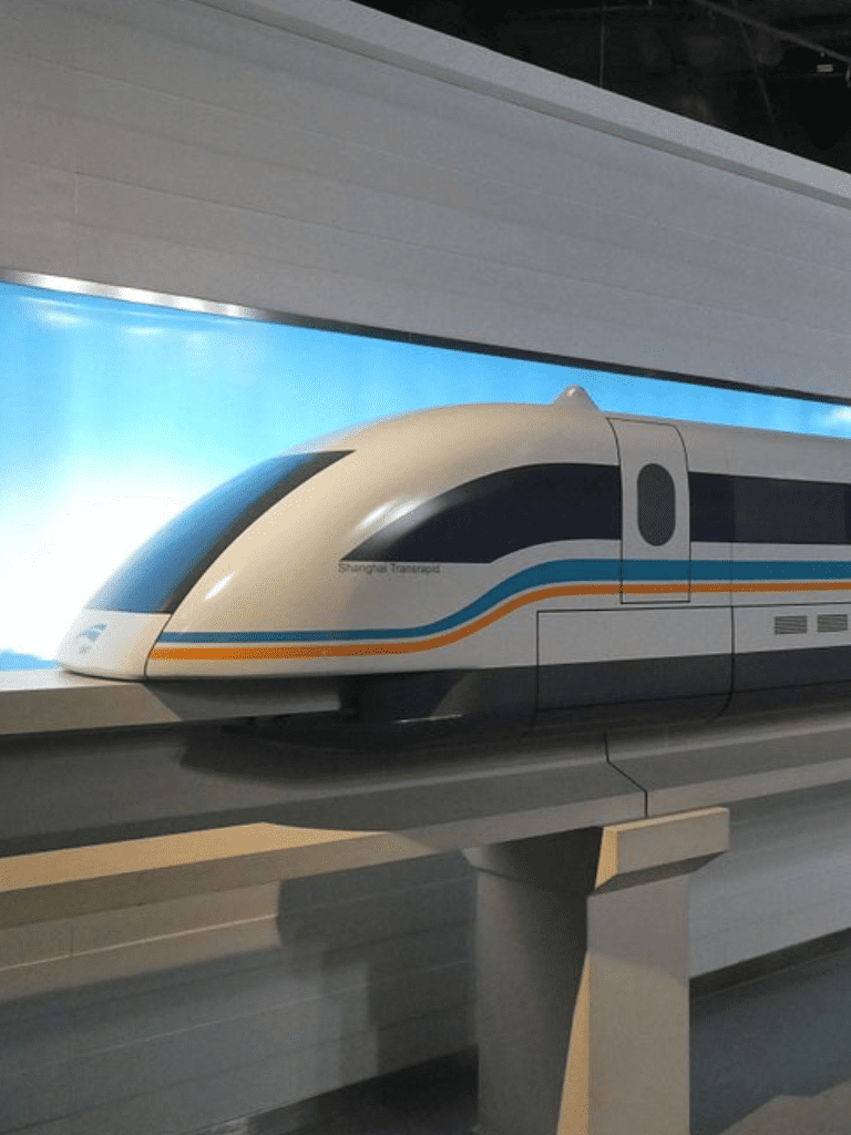 High-speed train model at QuestForDirections exhibit, showcasing innovative transportation technology.