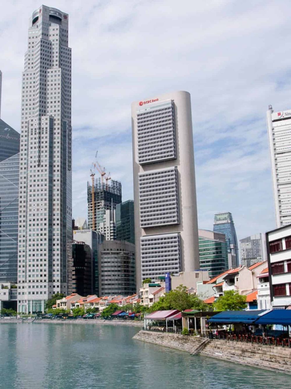 Modern Singapore skyline with skyscrapers and waterfront view.